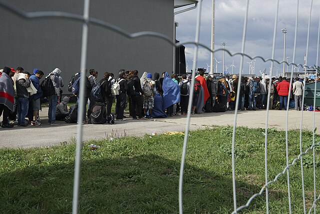 A line of Syrian refugees crossing the border of Hungary and Austria on their way to Germany. Hungary, Central Europe, 6 September
